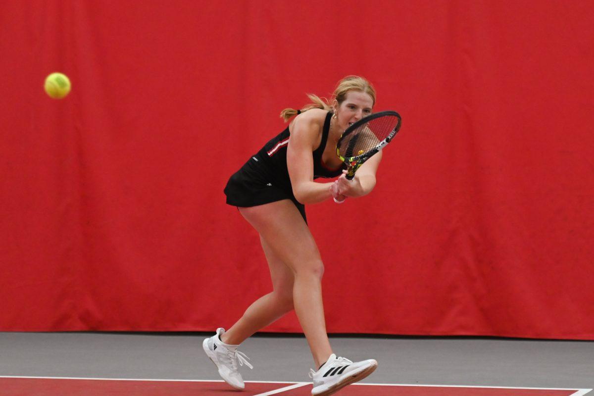Sophomore Maddy Zampardo lunges towards the ball during the match against Michigan at J. W. Isenhour Tennis Center on Friday, Feb. 14, 2025. Zampardo won her singles match 2-0. NC State beat Michigan 5-2.