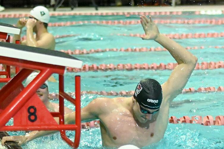 Sophomore Wells Walker slaps the water during the meet against UNC-Wilmington in the Casey Aquatic Center on Friday,&#160;Jan. 31, 2025. NC State beat UNC-Wilmington 161-114.
