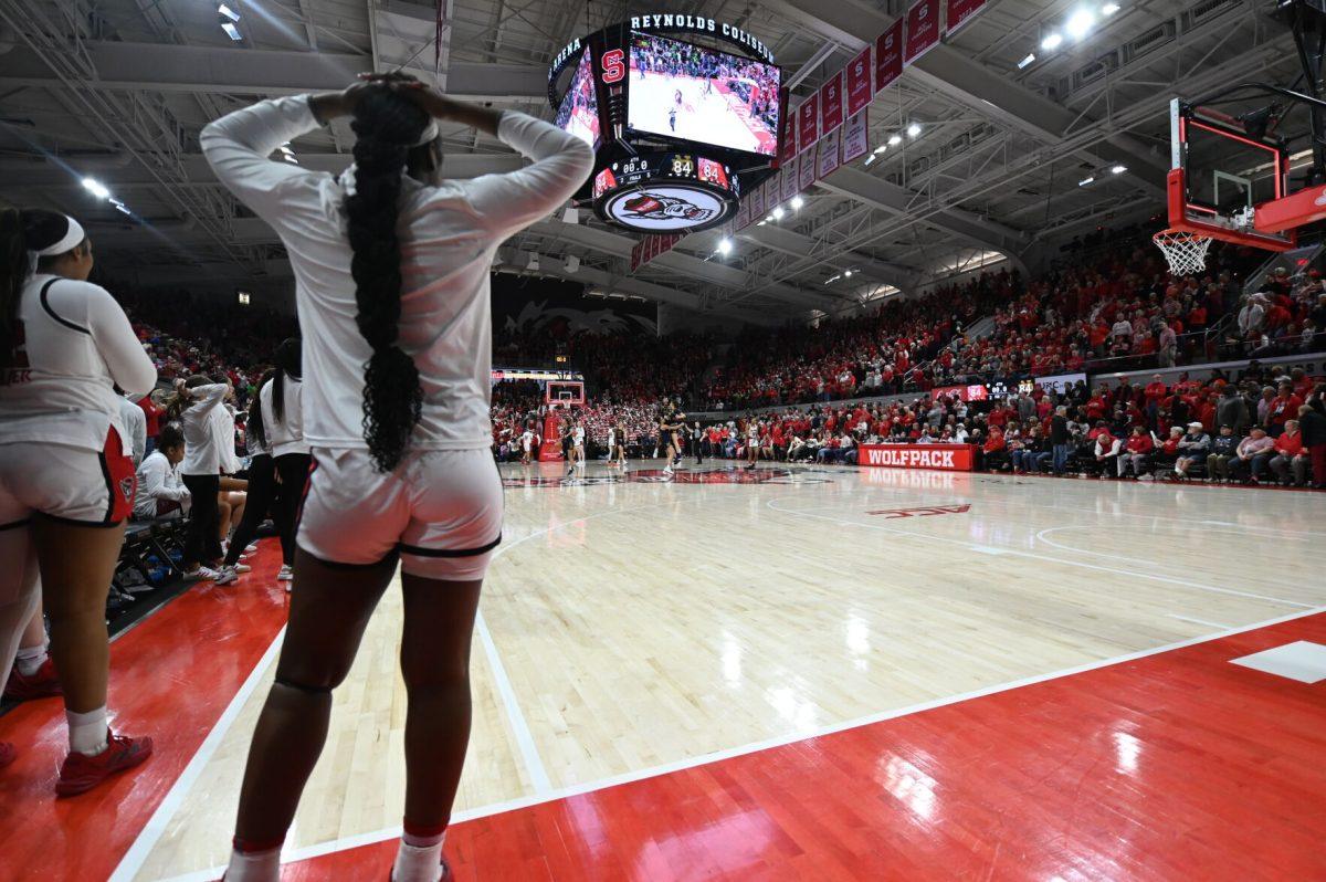 Freshman center Lorena Awou puts her hands on her head after Notre Dame scored a buzzer beater to send the game to overtime in Reynolds Coliseum on Sunday, Feb. 23, 2025. The Wolfpack beat the Fighting Irish 105-94 in double overtime.