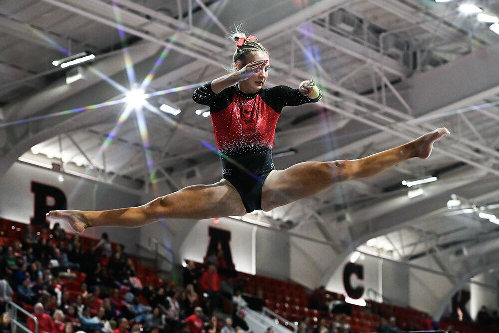 Sophomore Katie Harper performs a mid-air split on the balance beam during the meet against Ohio State in Reynolds Coliseum on Friday, March 7, 2025. Harper scored 9.825 on the beam. The Wolfpack beat the Buckeyes 197.000-196.325.