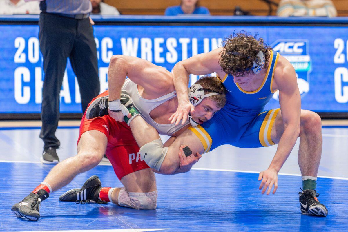 Redshirt sophomore Dylan Fishback attempts to take down his opponent during the ACC Wrestling Championship Tournament in Cameron Indoor Stadium on Sunday, March 9, 2025. Fishback placed second in the 184 weight class. NC State placed third overall with 62.5 points.