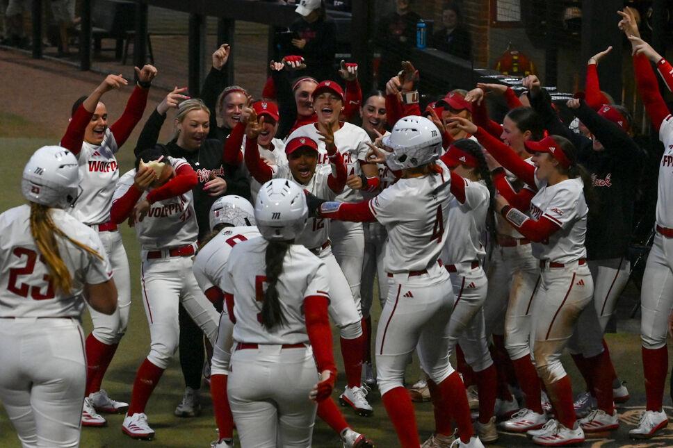 The NC State softball team celebrates redshirt junior infielder Michele Tarpey's home run during the game against UNC-Wilmington at Dail Softball Stadium on Saturday, March 1, 2025. Tarpey scored one home run. NC State beat UNC-Wilmington 14-1.