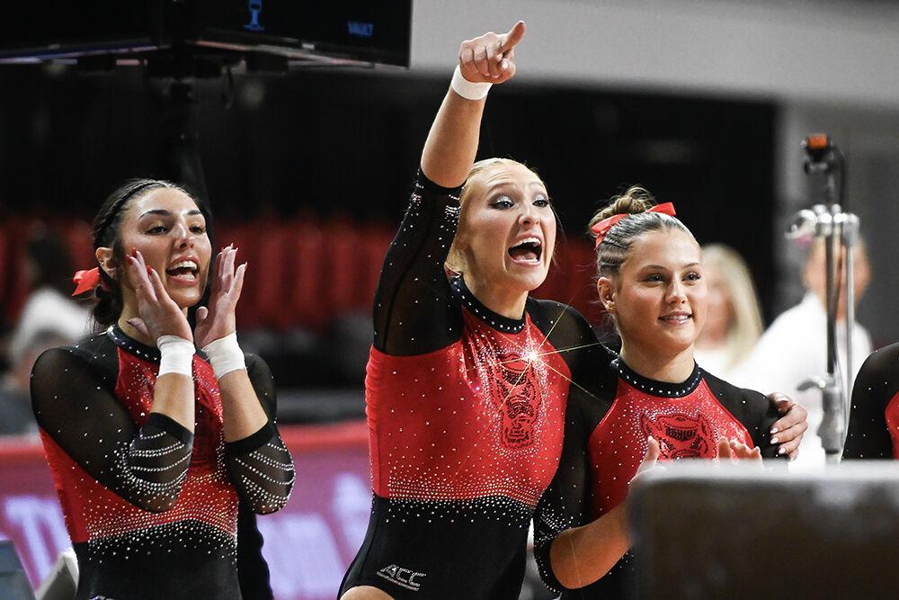 Junior Meg Alder, graduate Krista Zultevics, and senior Peyton Childs hype up their teammate during the meet against Ohio State in Reynolds Coliseum on Friday, March 7, 2025. The Wolfpack defeated the Buckeyes 197.000-196.325.