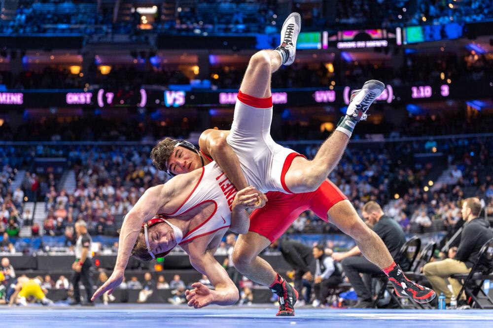 Redshirt sophomore Matty Singleton takes down his opponent during the NCAA Wrestling Championship Tournament in the Wells Fargo Center on Thursday, March 20, 2025. Singleton finished seventh in the 174 pound weight class. The Wolfpack placed eighth overall with 46.5 points.