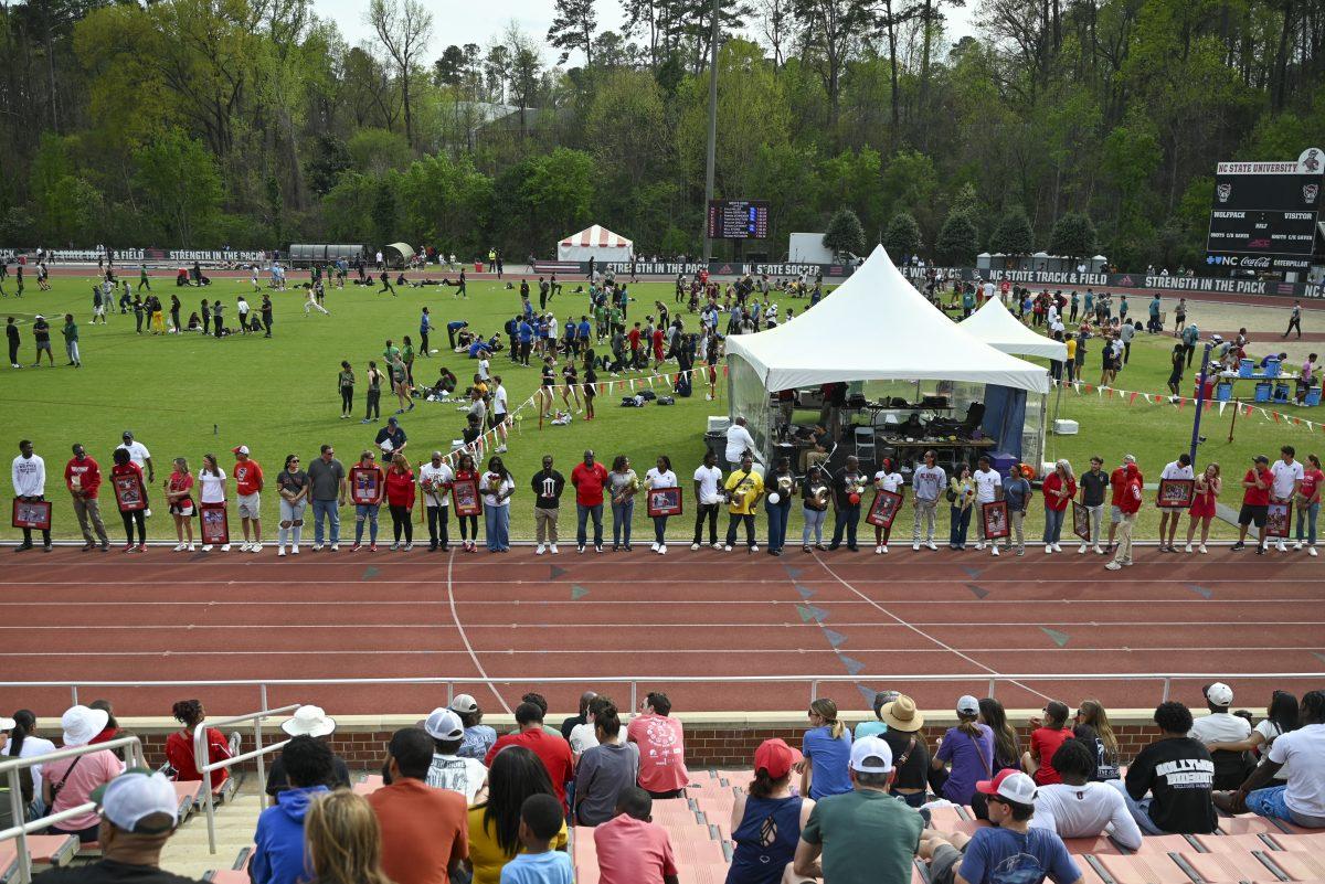 Seniors on the NC State track and field team stand to be recognized during the Raleigh Relays track meet at the Derr Track and Field Facility on Saturday, March 29, 2025.