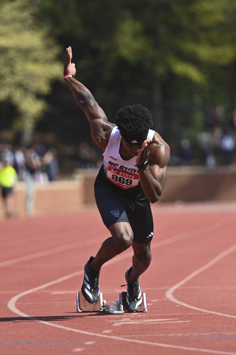 Junior sprinter Lance Patterson practices running off the blocks during the Raleigh Relays track meet at the Derr Track and Field Facility on Friday, March 28, 2025. Patterson ran the 400m with a time of 49.25.