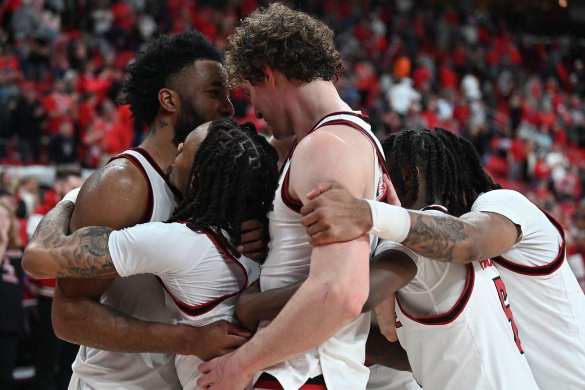 Seniors on the NC State men's basketball team hug on the court after the match against Pitt in the Lenovo Center on Wednesday, March 5, 2025. NC State had 32 rebounds total. The Wolfpack beat the Panthers 71-63.