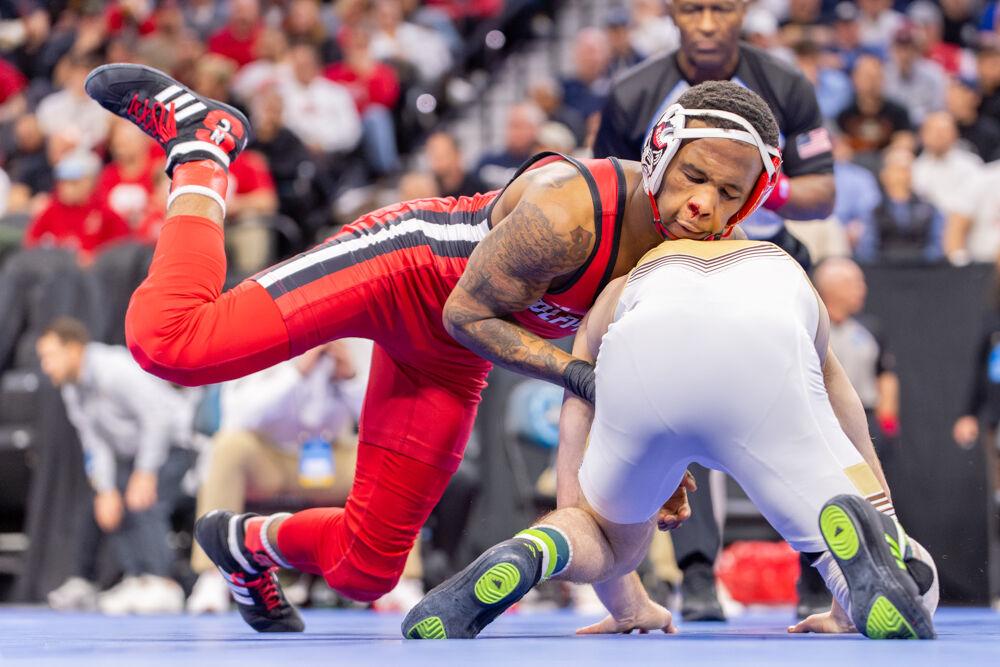Redshirt freshman Vince Robinson attempts to take down his opponent during the NCAA Wrestling Championship Tournament in the Wells Fargo Center on Thursday, March 20, 2025.