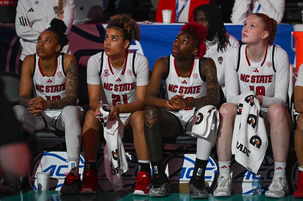(From left to right) senior guard Aziaha James, graduate guard Madison Hayes, senior guard Saniya Rivers and freshman forward Tilda Trygger watch the NC State hype reel before entering the championship game of the ACC Tournament against Duke in Greensboro Coliseum on Friday, March 7, 2025. The Wolfpack lost to the Blue Devils 76-62.