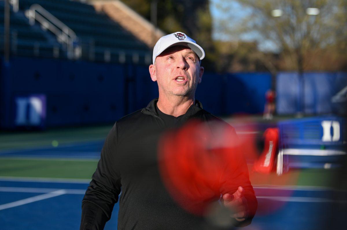 Head coach Simon Earnshaw expresses frustration with the umpire during the match against Duke at Ambler Tennis Stadium on Friday, March 21, 2025. NC State fell to Duke 3-4.