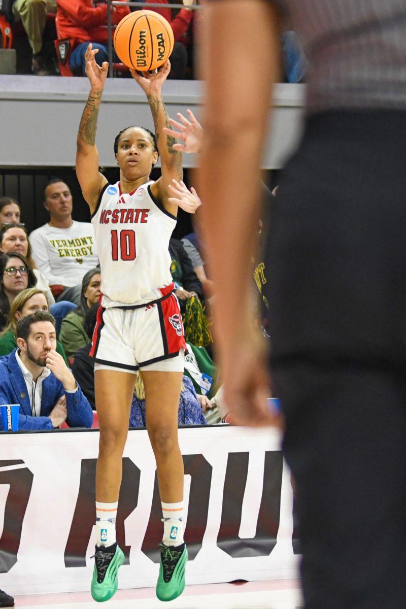 Senior guard Aziaha James shoots the ball during the first round game of the NCAA Tournament against Vermont in Reynolds Coliseum on Saturday, March 22, 2025. James scored 15 points, on top of making four rebounds and three assists. NC State won the game 75-55.