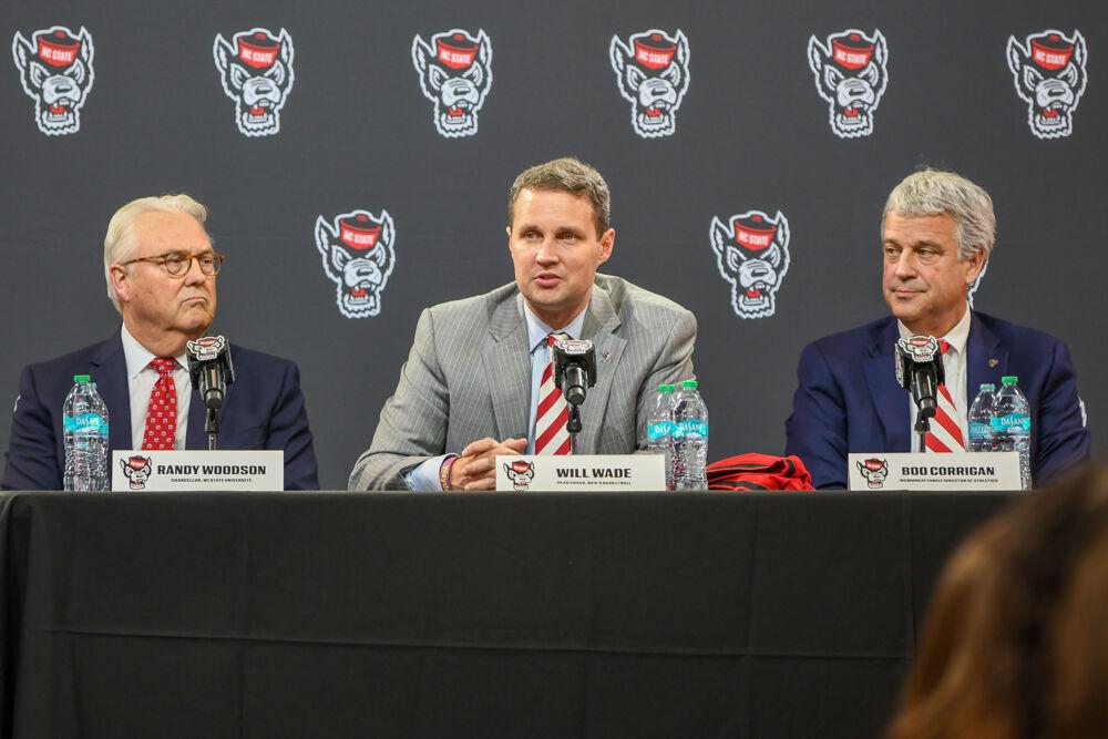 Will Wade (center), the new head coach of NC State men's basketball, answers questions during a press conference discussing Wade's hiring inside Reynolds Coliseum on Tuesday, March 25, 2025. Wade will serve as the new men's basketball coach after having been at McNeese State.