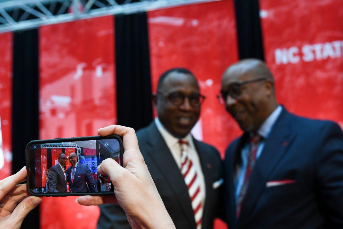 Chancellor-elect Kevin Howell poses with a guest after the new chancellor announcement at Talley Student Union on Tuesday, March 18th, 2025. Howell dedicated a plethora of time to personally greeting high profile guests to his announcement. He hugged and got photos taken with them.