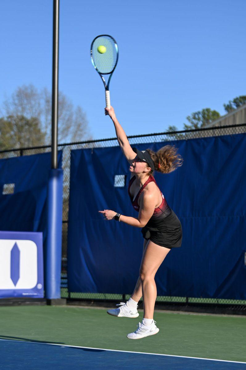 Junior Anna Zyryanova serves the ball during the match against Duke at Ambler Tennis Stadium on Friday, March 21, 2025. Zyryanova won her singles match 2-1. NC State fell to Duke 3-4.