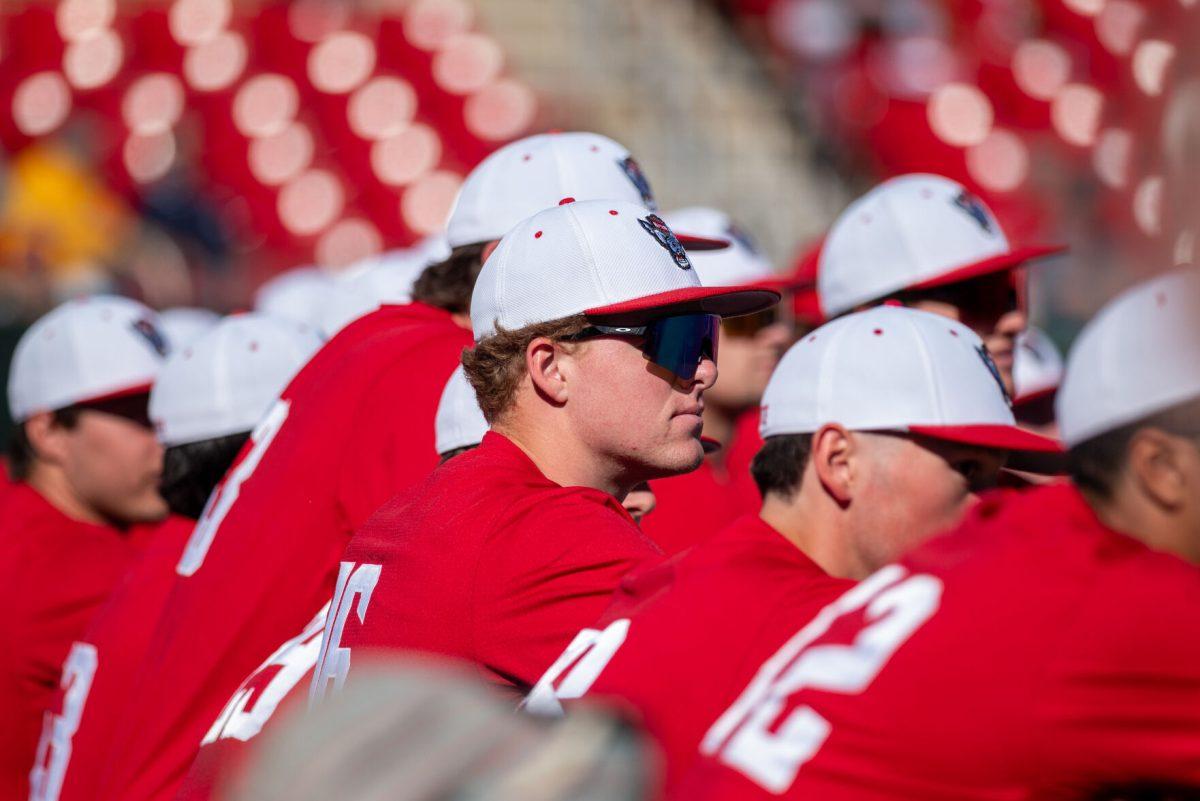 Freshman right-handed pitcher Truitt Manuel looks out at the feild while the line-up is caled before the game against Canisius at Doak Field at Dail Park on Feb. 28, 2025. NC State beat Canisius 10-2 in the first game of the series.