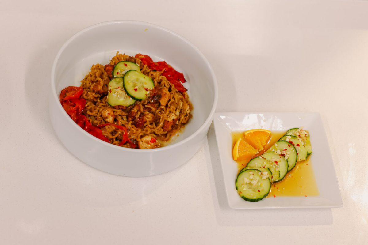 The final dish of team two during the MGC Chopped: Cooking Competition at Carmichael gym on Wednesday, March 26, 2025. The dish included ramen, chicken, roasted tomatoes and cucumber laid on top of citrus juice garnished with pomegranate seeds.