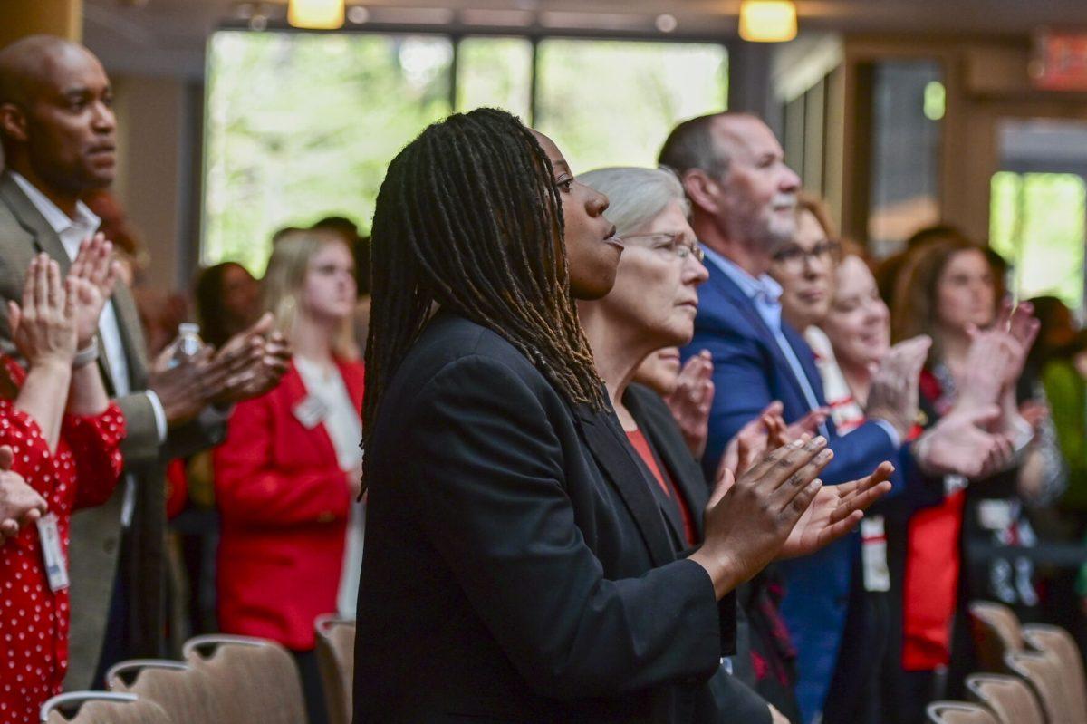 Lanadia Adams, a fourth-years studying political science and criminology, claps during the new chancellor announcement in Talley Student Union on Tuesday, March 18, 2025. Kevin Howell will be the 15th chancellor of NC State and the first Black chancellor.