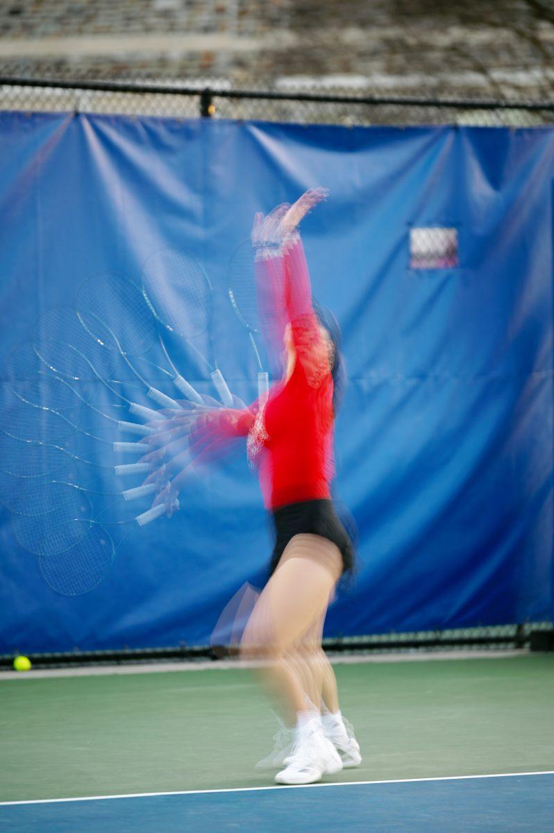 Freshman Michaela Laki serves the ball during the match against Duke at Ambler Tennis Stadium on Friday, March 21, 2025. Laki won her singles match 2-1. NC State fell to Duke 3-4.