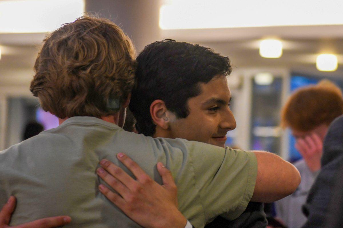 Reagan Lineberry, a second-year studying political science and history, hugs Isaac Carreno, a third-year studying social work and political science, after Carreno is announced as the winner of the student government Presidential election during the election watch party at Talley Student Union on Wednesday, March 5th, 2025.