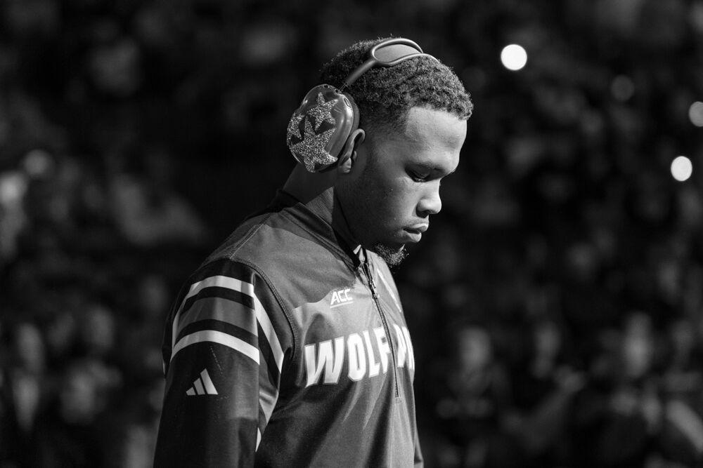 Redshirt freshman Vince Robinson walks out during the Parade of All-Americans during the NCAA Wrestling Championship Tournament in the Wells Fargo Center on Saturday, March 22, 2025. Robinson won the championship for the 125 pound weight class. The Wolfpack placed eighth overall with 46.5 points.