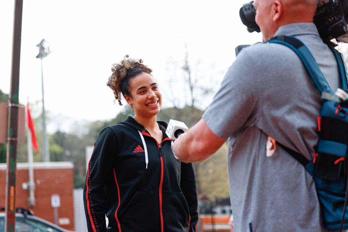 Graduate guard Madison Hayes smiles while being interviewed during the teams welcome back to Reynolds Coliseum on Saturday, March 29. Hayes played in all 35 games during her graduate season averaging 10.9 points per game.