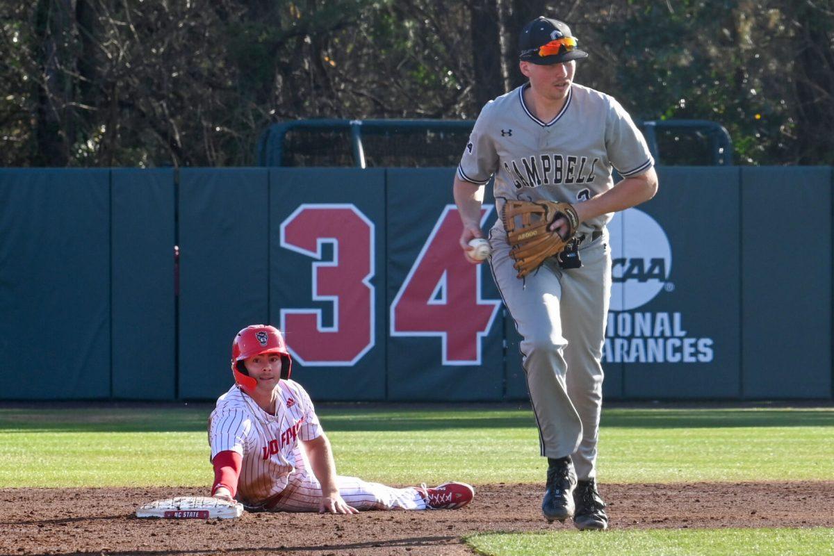 Junior outfielder Josh Hogue is thrown out attempting to steal a base during the game against Campbell on Doak Field at Dail Park on Wednesday, March 5, 2025. The Wolfpack defeated the Fighting Camels 11-1.