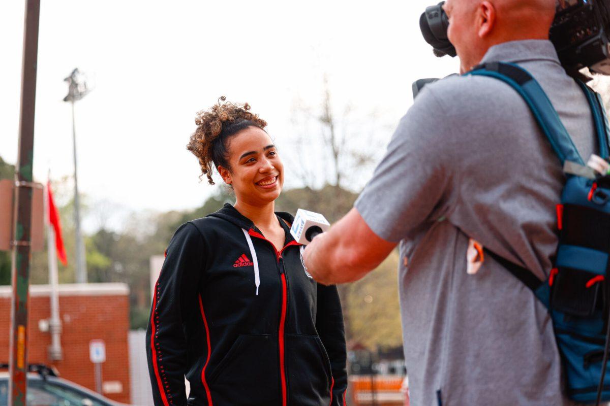 Graduate guard Madison Hayes smiles while being interviewed during the teams welcome back to Reynolds Coliseum on Saturday, March 29. Hayes played in all 35 games during her graduate season averaging 10.9 points per game.