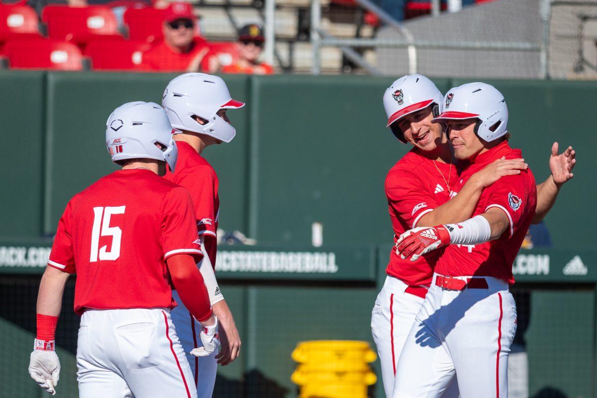 Redshirt sophomore outfielder Drew Lanphere, junior outfielder Josh Hogue, and sophomore infielder Chris McHugh, Freshman outfielder Ty Head celebrate after the grand slam during the game against Canisius at Doak Field at Dail Park on Feb. 28, 2025. NC State beat Canisius 10-2 in the first game of the series.