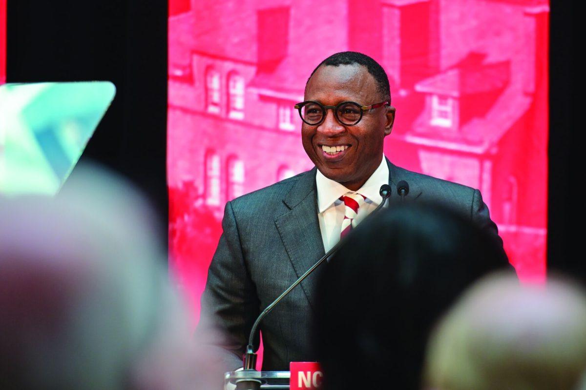 Chancellor-elect Kevin Howell smiles after walking on stage during the new chancellor announcement in Talley Student Union on Tuesday, March 18, 2025. Howell will be the 15th chancellor of NC State and the first Black chancellor. "I'm humble, I'm excited and I'm ready," said Howell.