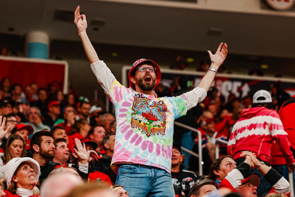 A fan wearing a Grateful Dead t-shirt cheers during the third period in the Hurricanes game against the Nashville Predators at the Lenovo Center on Tuesday, March 25, 2025. The Hurricanes lost 3-1.