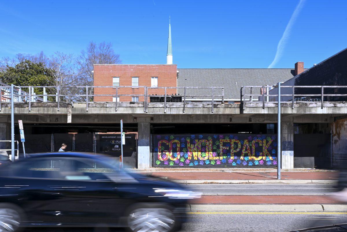 Cars drive past a vacant lot next to the Target on Hillsborough Street on Friday, Feb. 14, 2025. The vacant lot has been empty for a decade but developers plan to use it for either housing or commercial use.
