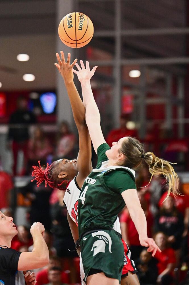 Senior guard Saniya Rivers attempts to gain possession in the tip-off during the second round game of the NCAA Tournament against Michigan State in Reynolds Coliseum on Monday, March 24, 2025. Rivers scored 17 points, on top of making 11 assists, eight rebounds, two steals and two blocks. The Wolfpack beat the Spartans 83-49.