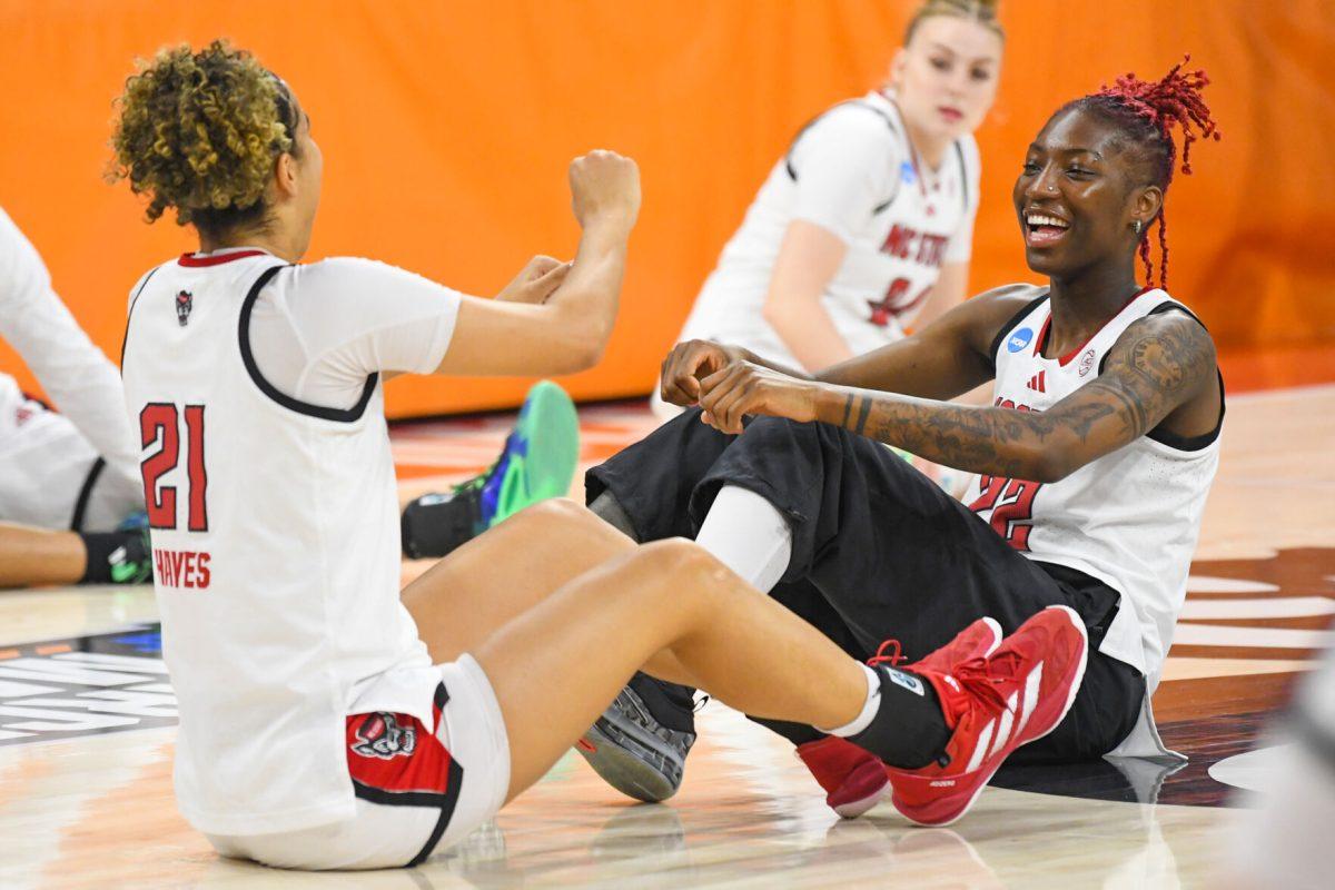Graduate guard Madison Hayes (left) and senior guard Saniya Rivers (right) dance while warming up before the first round game of the NCAA Tournament against Vermont in Reynolds Coliseum on Saturday, March 22, 2025. NC State won the game 75-55.