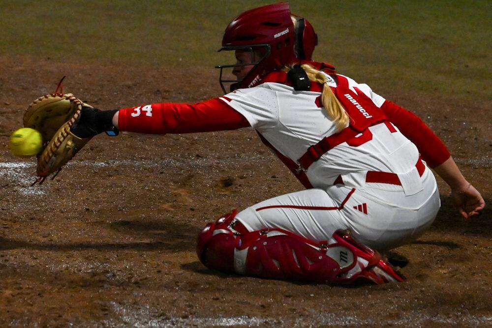 Redshirt senior catcher Payden Bordeau leans to catch a pitch during the game against UNC-Wilmington at Dail Softball Stadium on Saturday, March 1, 2025. The Wolfpack defeated the Seahawks 14-1.