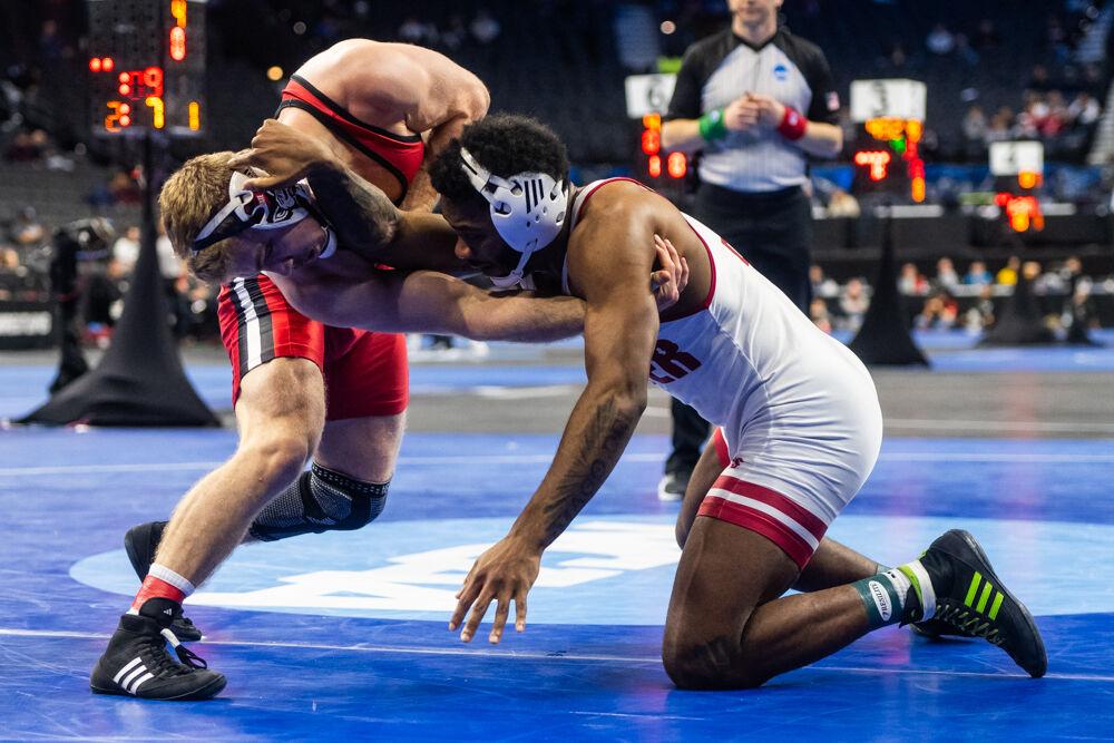 Redshirt sophomore Dylan Fishback grapples with his opponent during the NCAA Wrestling Championship Tournament in the Wells Fargo Center on Friday, March 21, 2025.&#160;The Wolfpack placed eighth overall with 46.5 points.