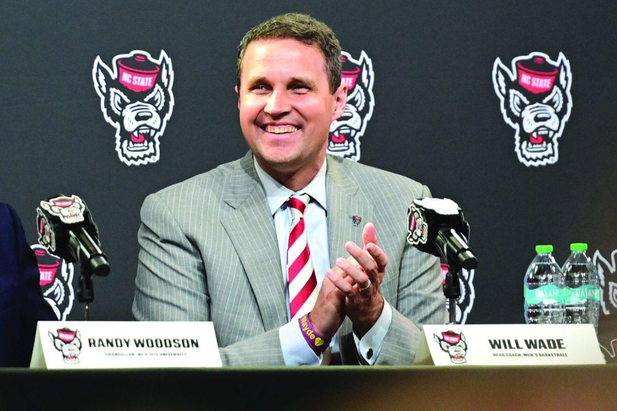 Will Wade smiles and claps during the press conference inside Reynolds Coliseum on Tuesday, March 25th, 2025. NC State introduced Will Wade as its 21st head coach in program history.