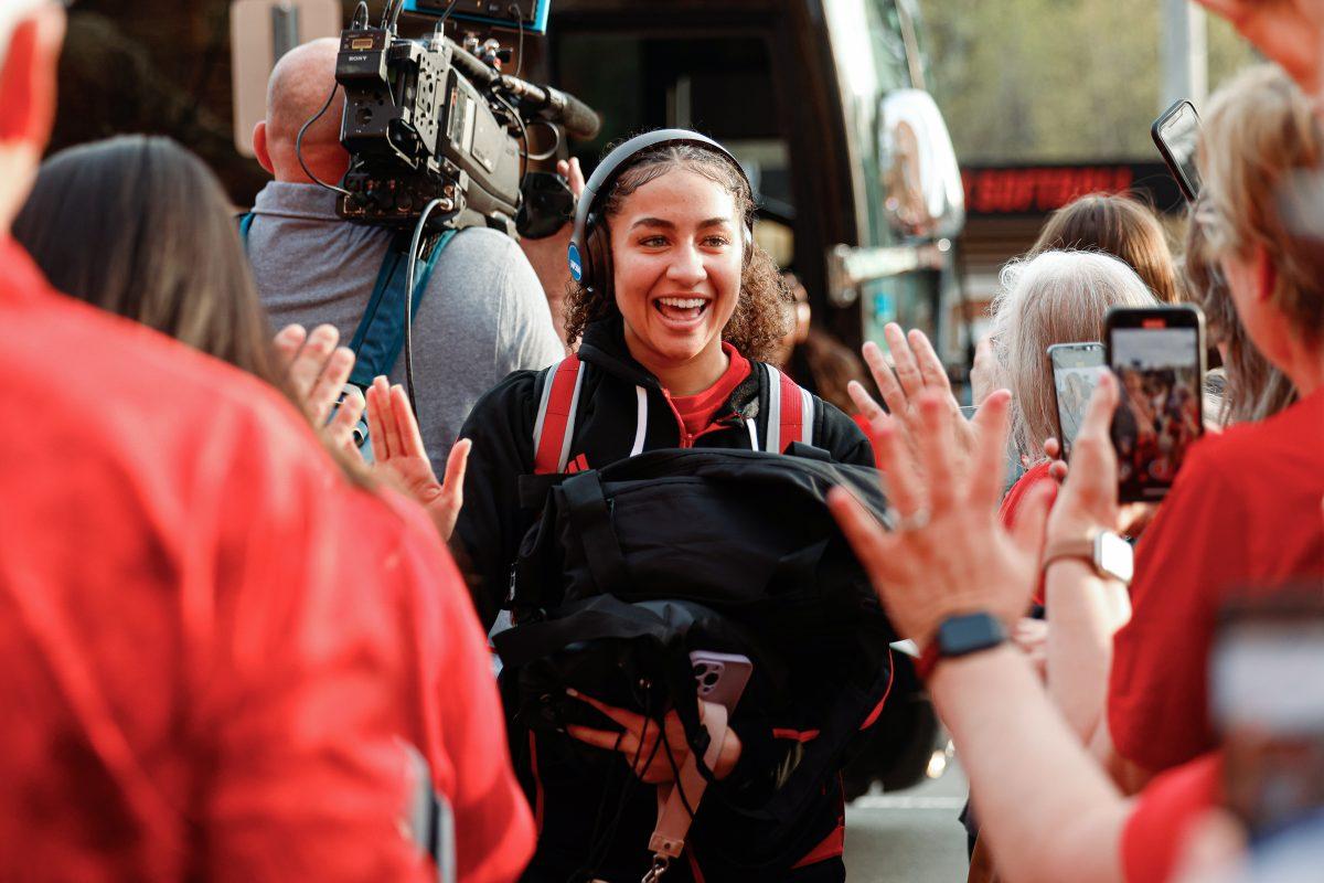 Freshman guard Devyn Quigley puts out her hands to high-five fans during the team's welcome back to Reynolds Coliseum on Saturday, March 29, 2025. Quigley played in 33 games during her freshman season averaging 2.5 points per game.