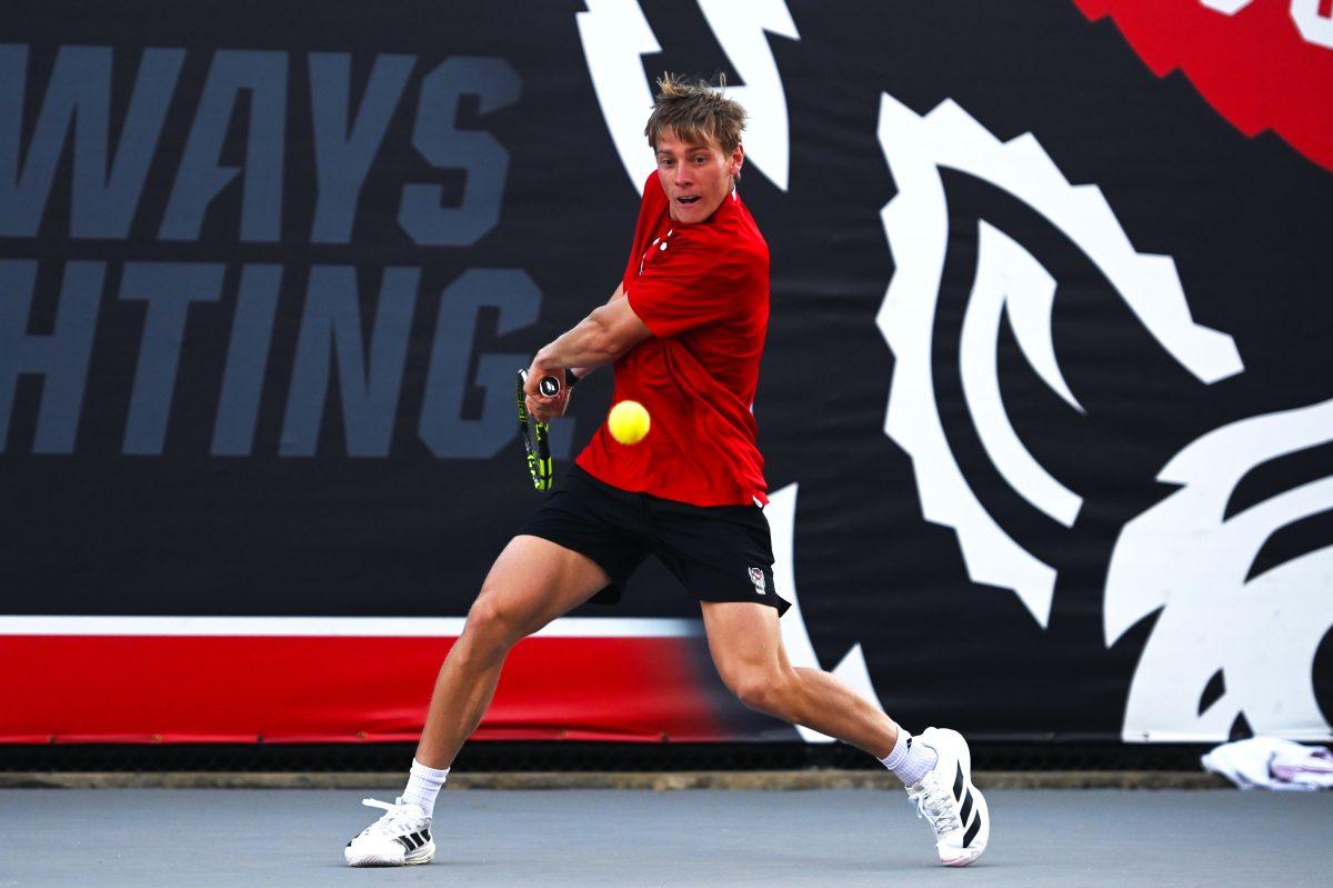 Senior Fons Van Sambeek forehands the ball during his singles match versus Cal at J.W. Isenhour tennis center on Friday, Feb. 28, 2025. Von Sambeek won his singles match 2-0 (6-2, 6-1). The Wolfpack beat the Golden Bears 4-2.