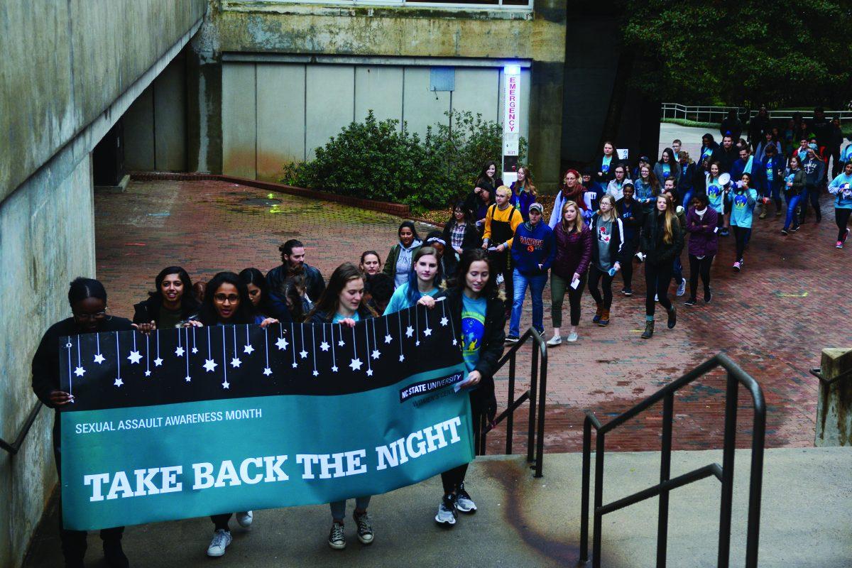 Students at the Take Back the Night March make their way up the stairs to bring awareness to sexual assault and dating violence on campus on Tuesday, April 2. Take Back the Night is an annual event that is a part of Sexual Assault Awareness Month.