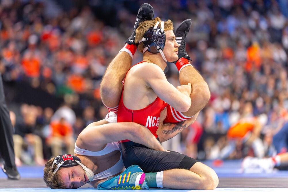 Redshirt senior Kai Orine begins to lift his opponent during the NCAA Wrestling Championship Tournament in the Wells Fargo Center on Thursday, March 20, 2025.&#160;The Wolfpack placed eighth overall with 46.5 points.