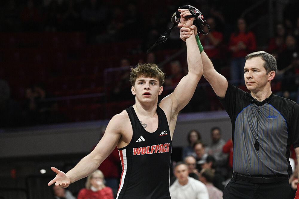Redshirt sophomore Troy Hohman celebrates his victory during the duel against Stanford in Reynolds Coliseum on Friday, Feb. 14, 2025. Hohman won the 141 bout 5-3. The Wolfpack beat the Cardinal 27-13.