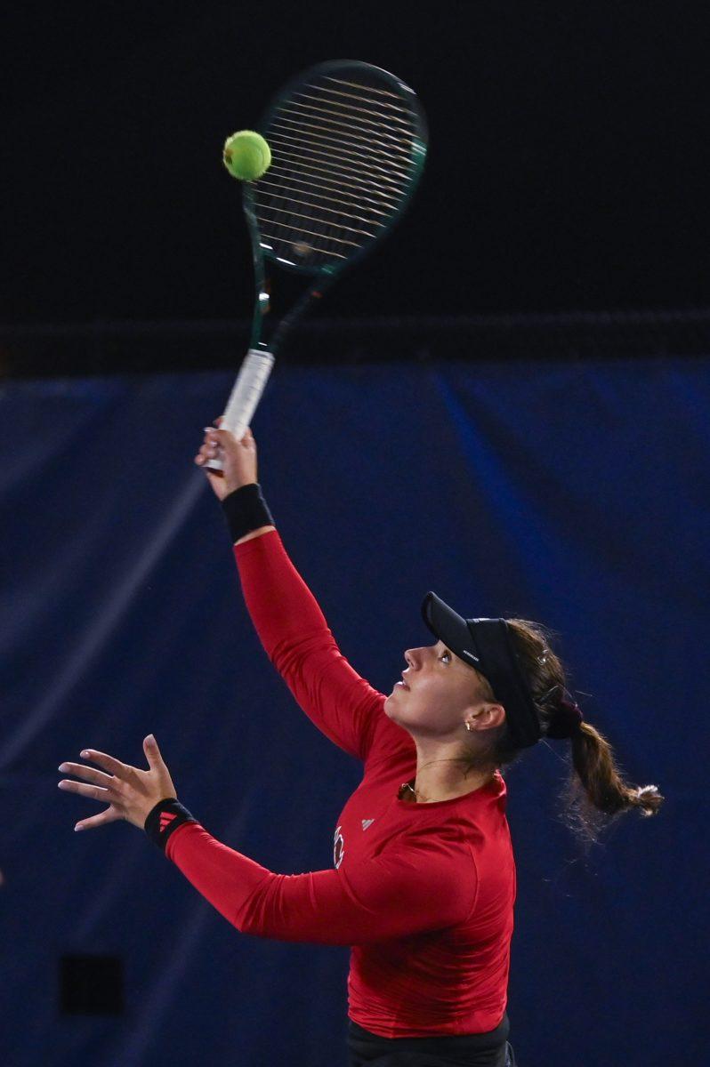 Freshman Michaela Laki jumps for the ball during the match against Duke at Ambler Tennis Stadium on Friday, March 21, 2025. Laki won her singles match 2-1. NC State fell to Duke 3-4.