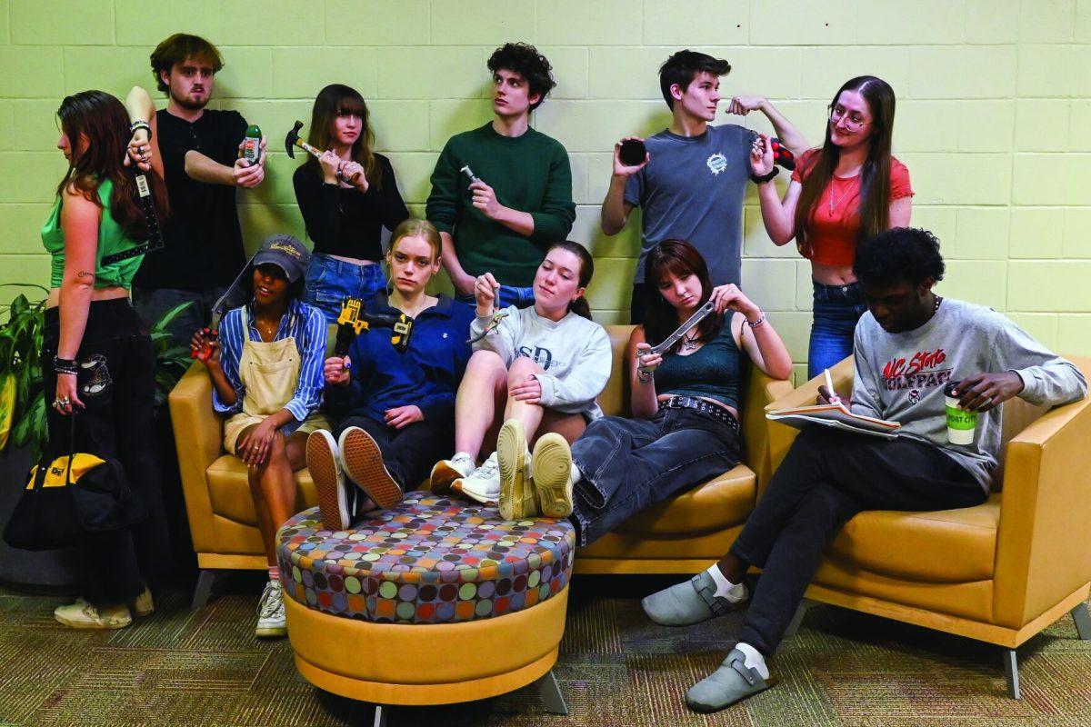 Writers in the opinion section of Technician pose for a photo with items found in a toolbox on Tuesday, March 25.