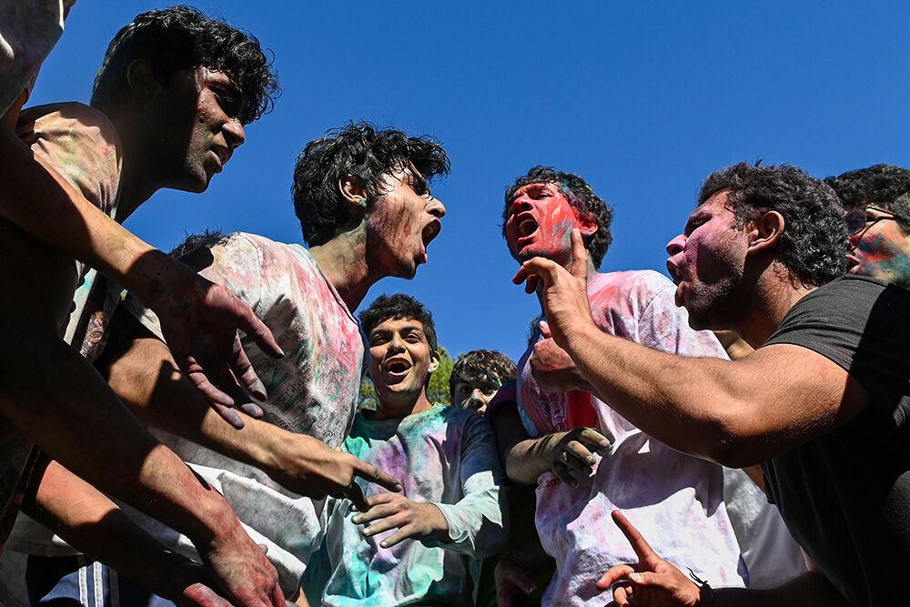 NC State students yell the lyrics to a song during the Holi celebration at Stafford Commons on Saturday, March 4, 2023. Holi, also known as the Festival of Colors, is an annual Hindu celebration of good defeating evil and marks the beginning of Spring.
