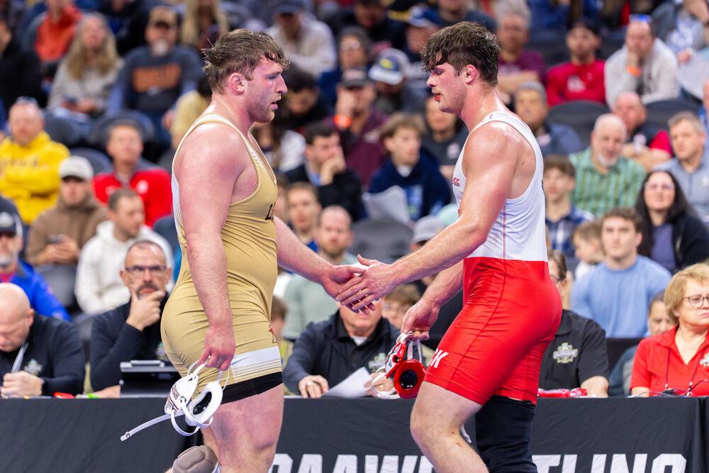 Redshirt junior Isaac Trumble shakes hands after defeating former NC State wrestler Owen Trephan during the NCAA Wrestling Championship Tournament in the Wells Fargo Center on Saturday, March 22, 2025. Trumble placed fourth and Trephan placed fifth for the heavyweight class. NC State finished eighth overall with 46.5 points.