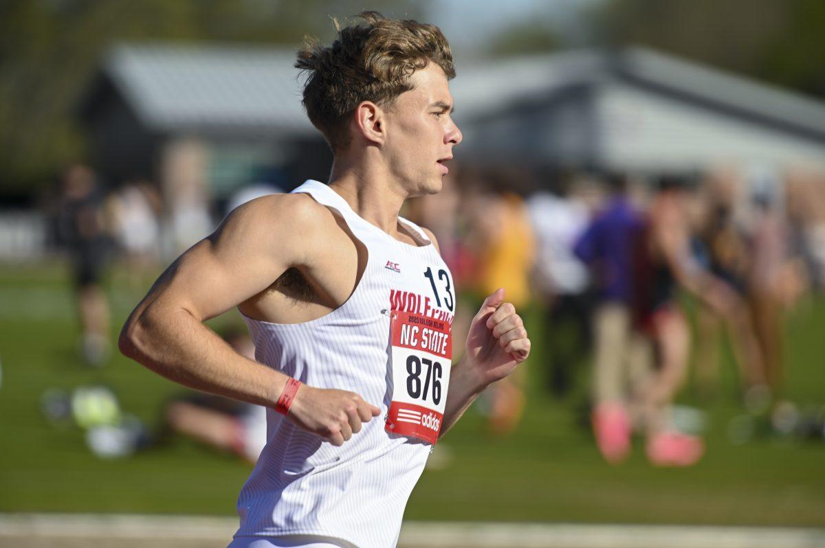 Distance runner Patrick Tuohy pumps his arms as he runs in the 1500m during the Raleigh Relays track meet at the Derr Track and Field Facility on Thursday, March 27, 2025. Tuohy finished with a time of 4:02.36, earning him a new personal best in the process.
