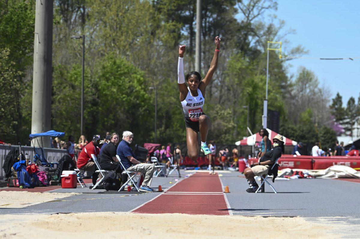 Sophomore Jada Hunter leaps into the sand pit during the Raleigh Relays track meet at the Derr Track and Field Facility on Friday, March 28, 2025. Hunter finished third in the triple jump event with a distance of 12.47 meters.