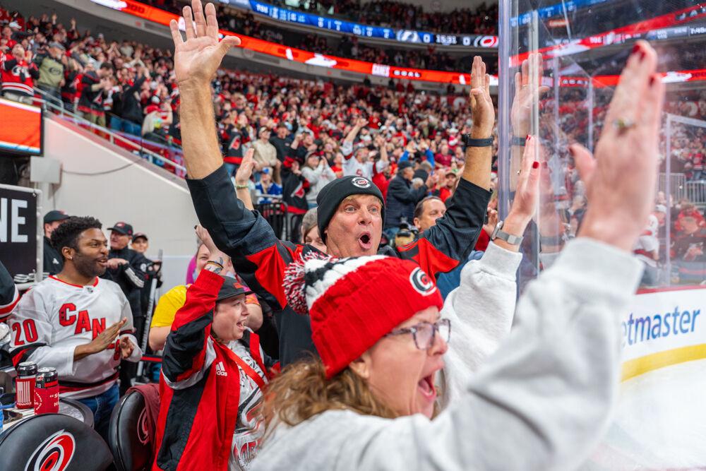 Carolina Hurricanes fans celebrate a goal during the game against the Tampa Bay Lightning at the Lenovo Center on Tuesday, March 11, 2025. The Hurricanes beat the Lightning 4-1.