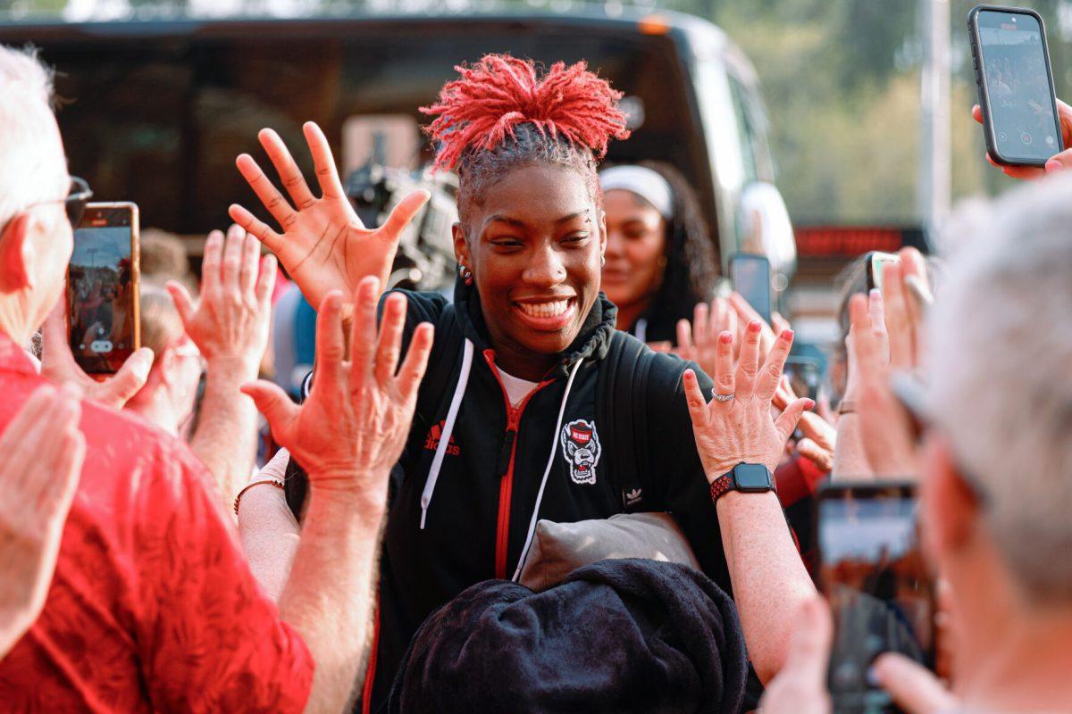 Senior guard Saniya Rivers high-fives fans during the team's welcome back to Reynolds Coliseum on Saturday, March 29, 2025. Rivers played in all 35 games during her senior season averaging 11.9 points per game.