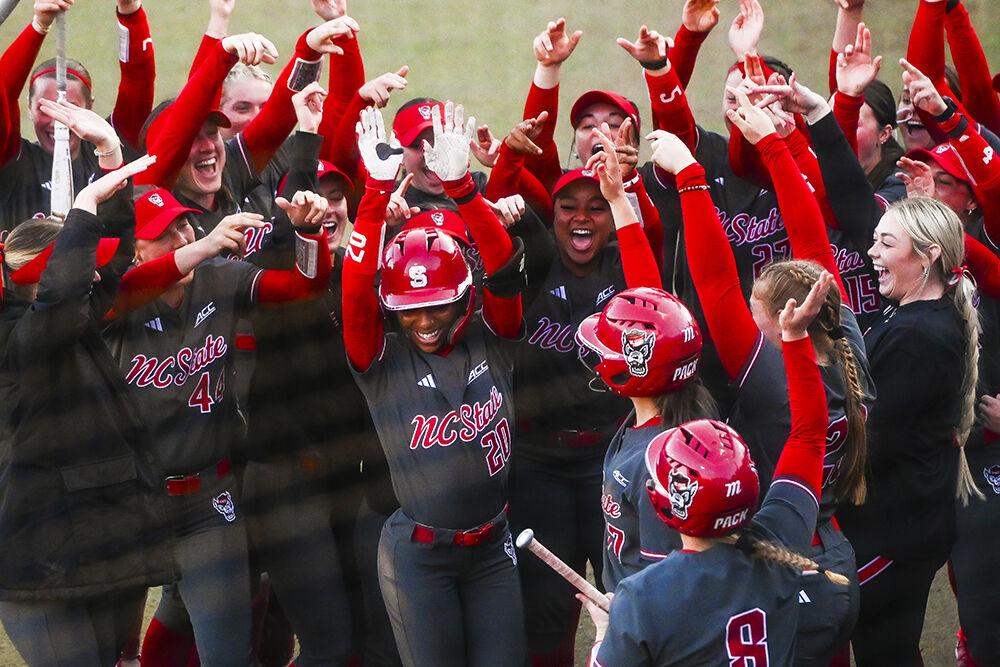 The softball team celebrates junior utility player MaKayla Marbury's home run during the game against UNC-Wilmington at Dail Softball Stadium on Friday, Feb. 28, 2025. NC State lost to UNC-Wilmington 5-4.